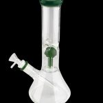 Glass bong with green accents against a black background.
