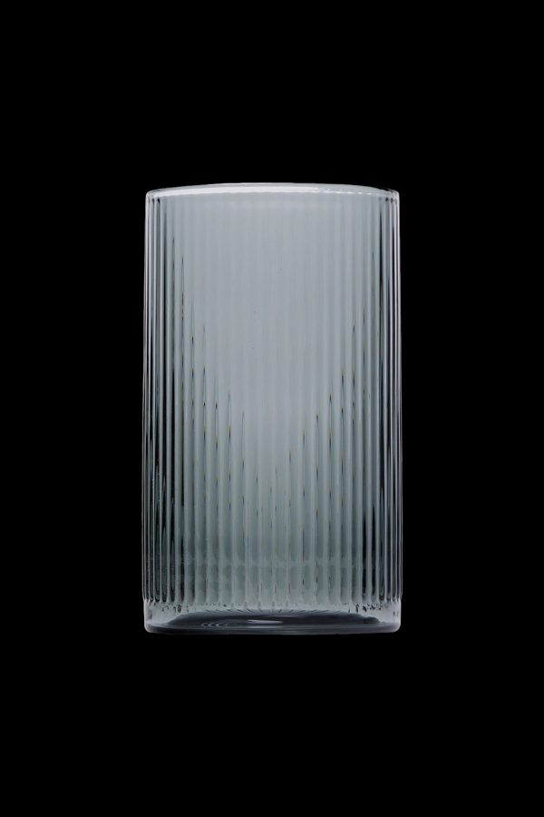 Ribbed glass smoking pipe against a black background.