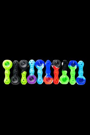 Assorted glass cannabis pipes in vibrant colors, arranged in a row against a black background.