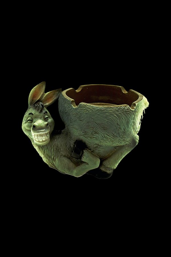 Ceramic donkey ashtray with a textured green finish, isolated on a black background.