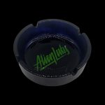 Black glass ashtray with green “Alien Labs” logo.