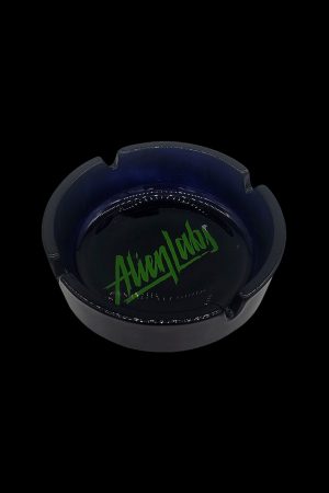 Black glass ashtray with green “Alien Labs” logo.