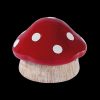 Red and white spotted mushroom-shaped cannabis storage container.