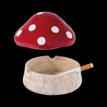 Red mushroom ashtray with a partially smoked joint inside.