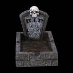 A spooky Halloween-themed ashtray shaped like a tombstone with “R.I.P. HERE LIES MY ASHES” inscribed on it.