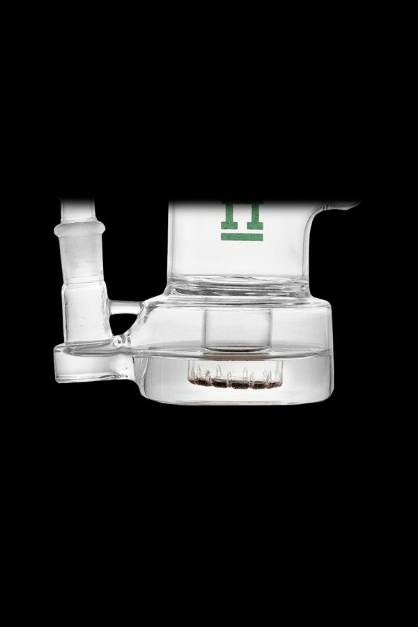 Clear glass dab rig with green logo, isolated on black.