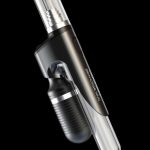 Sleek black cannabis oil vape pen with glass mouthpiece and charging base.