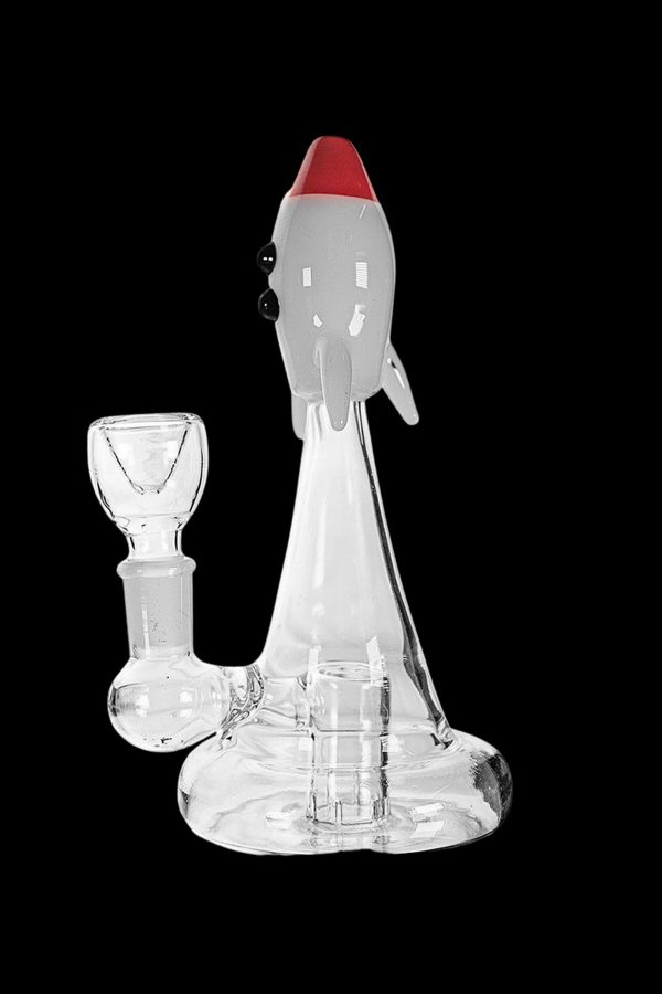 Glass water pipe shaped like a rocket ship with a separate glass bowl.