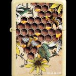 Gold lighter decorated with a honeycomb pattern, bees, and wildflower illustrations, branded "Pulsar."