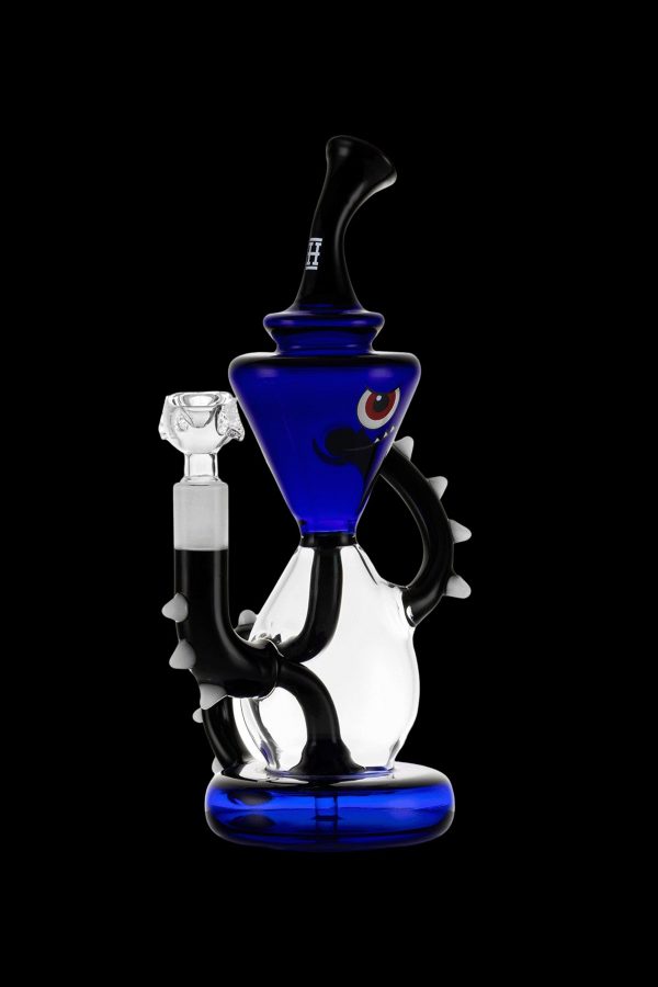 Blue glass water pipe (rig) with intricate design and silver accents, isolated on a black background.