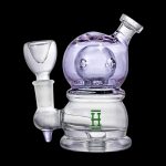 Lavender glass rig with a green logo and accompanying glass bowl.