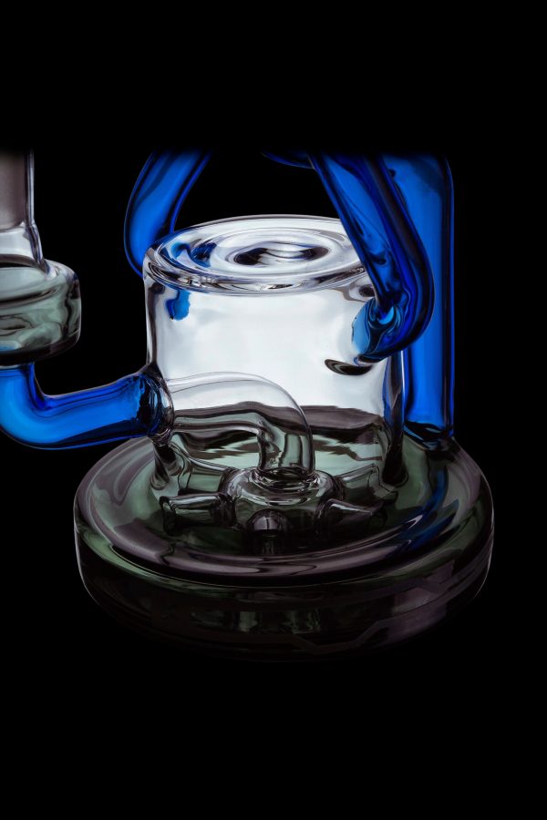A vibrant glass rig with blue and green accents, designed for cannabis concentrate use.