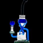 Blue glass dab rig with water filtration, featuring a perc chamber and angled mouthpiece.
