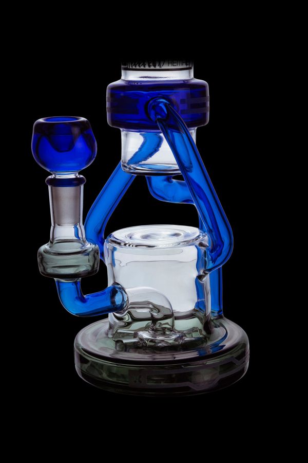 Blue glass water pipe (rig) with intricate curves and a clear glass bowl.