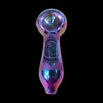 Iridescent glass pipe with etched designs, isolated on a black background.