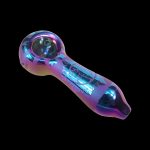 Iridescent glass pipe with etched floral designs, isolated on a black background.