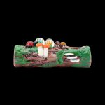 Hand-painted glass pipe resembling a forest floor with colorful mushrooms and foliage.