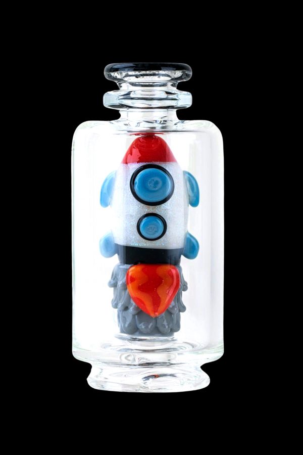 Glass rocket ship-shaped cannabis water pipe inside a clear display jar.
