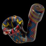 Colorful glass cannabis pipe with swirling patterns against a black background.