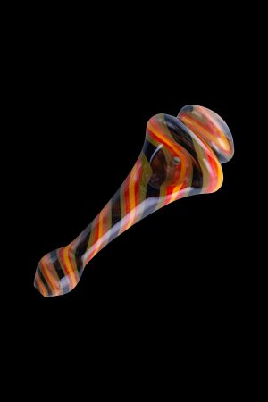Hand-blown glass pipe with colorful stripes, isolated on black.