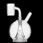 Clear glass dab rig with a quartz banger and mouthpiece.