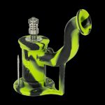 Green silicone oil rig with metal downstem and dab tool.
