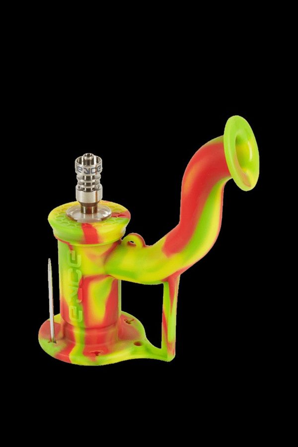 Colorful silicone dab rig with a glass bowl and carb cap, isolated on a black background.