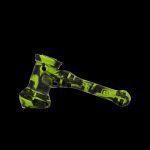 Green and black silicone cannabis pipe on a black background.
