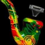 Colorful glass water pipe with detached bowl piece.