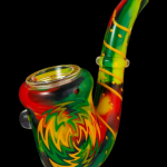 Colorful glass pipe with swirling green, red, and yellow patterns.