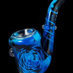 Blue glass bubbler with intricate swirling patterns.