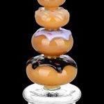 Glass cannabis rig shaped like a stack of glazed donuts.