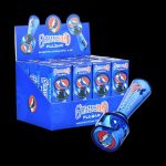 A display box of Grateful Dead-themed Pulsar geometric spoon pipes, showcasing the colorful glass pipes within.