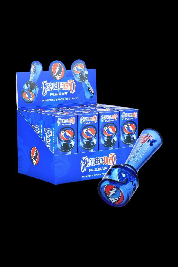 A display box of Grateful Dead-themed Pulsar geometric spoon pipes, showcasing the colorful glass pipes within.
