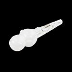 White glass cannabis oil burner pipe isolated on a black background.