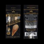 Close-up of a pack of King Palm Gelato Cream rolling papers, featuring a gold logo and text detailing the product's terpene infusion and slow-burning qualities.