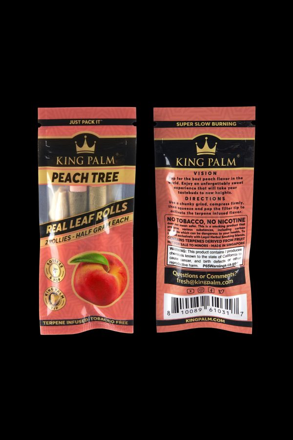 Close-up of King Palm peach-flavored Real Leaf Rolls packaging, featuring a peach graphic and warning labels.