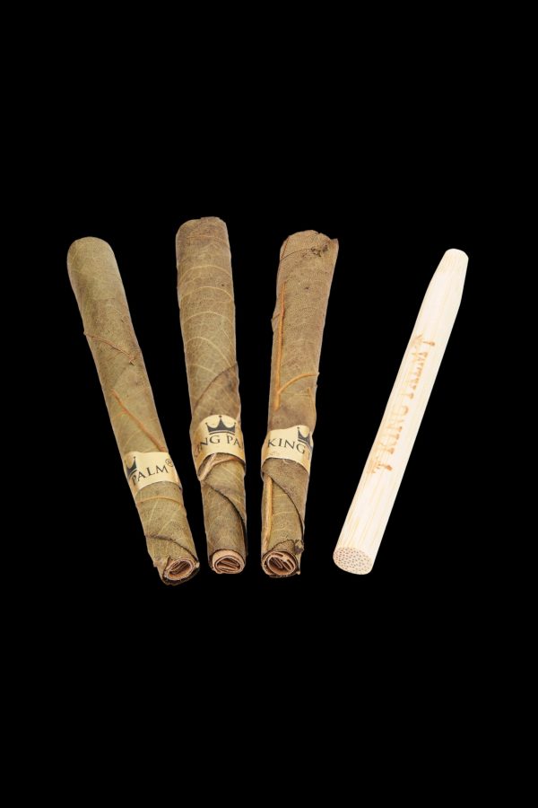 Four pre-rolled cannabis blunts and a wooden rolling tray on a black background.