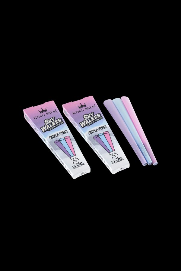 Two packs of King Palm Sky Walker pre-rolled cones in shades of pink and blue against a black background.