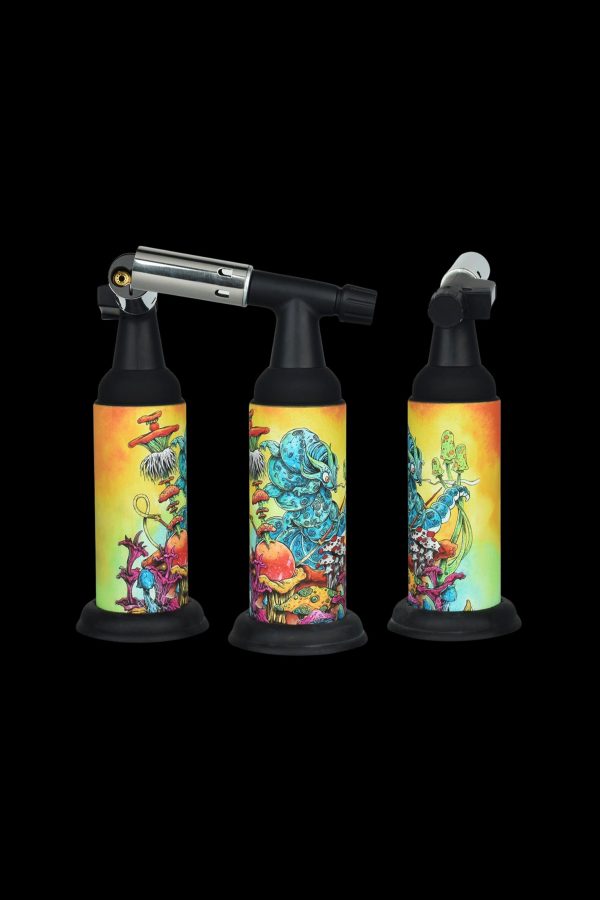 Three butane torches with psychedelic mushroom-themed artwork against a black background.