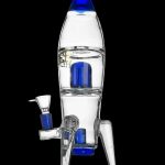 Glass water pipe shaped like a rocket ship with blue accents.