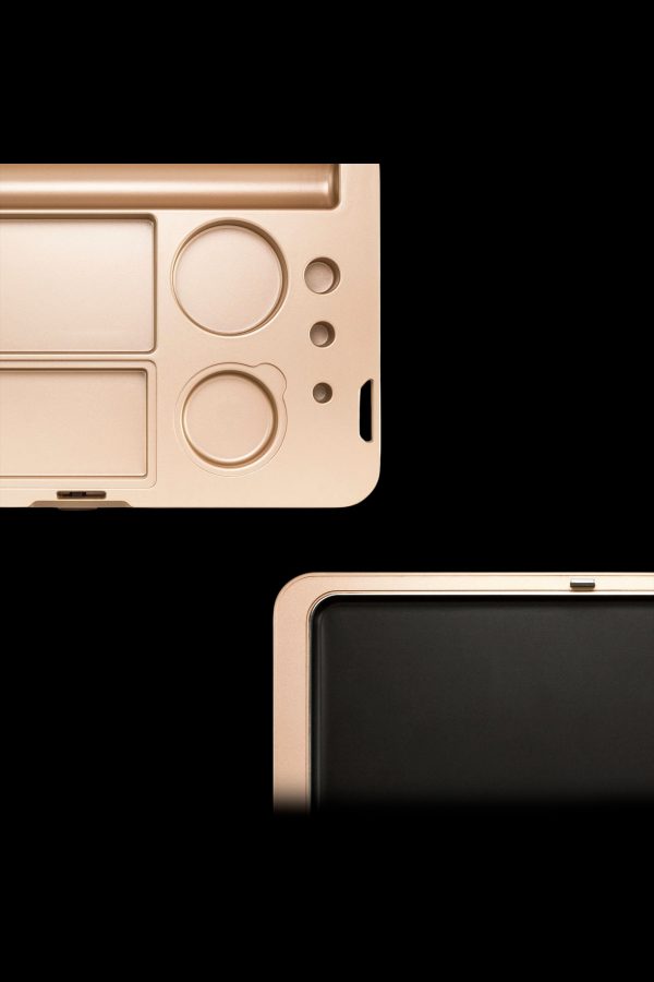 Gold cannabis accessory organizer with compartments for tools and product, displayed open and closed.