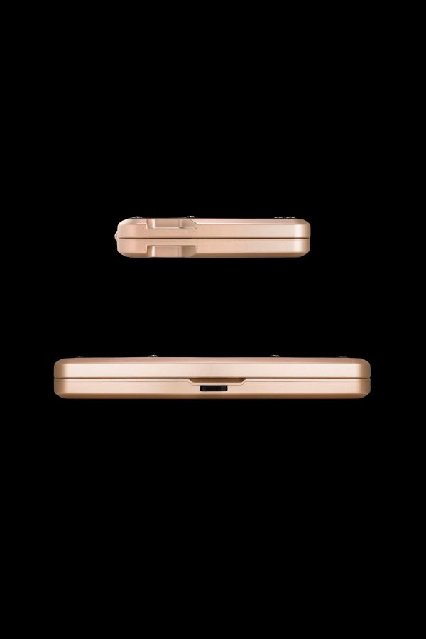 Gold cannabis storage case, shown from side and top views.