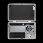 Silver cannabis kit with open case displaying pen, cartridge, and storage compartments.
