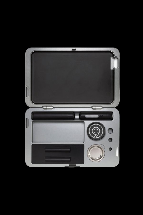 Silver cannabis kit with open case displaying pen, cartridge, and storage compartments.