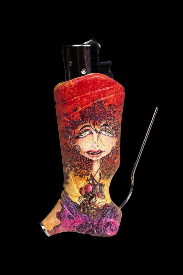 A decorated lighter with a colorful, psychedelic portrait of a woman and a thin metal tool extending from its side, set against a black background.