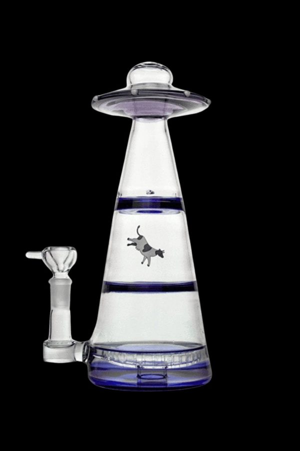 Clear glass water pipe shaped like a UFO with a cowboy riding a bucking bronco silhouetted within the water chamber, against a dark background.