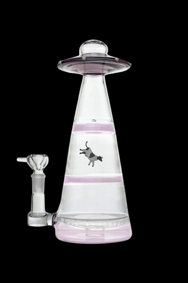 Pink glass water pipe shaped like a UFO with a cow illustration.