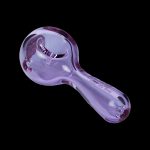Purple glass smoking pipe on a black background.