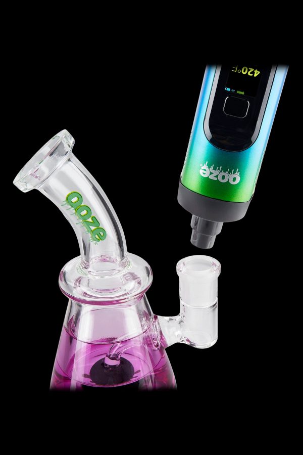 Ooze vaporizer pen connected to a glass water pipe.